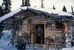 image-w-cred-cap_-1200w_-proenneke-cabin-page_-proenneke-in-doorway_2