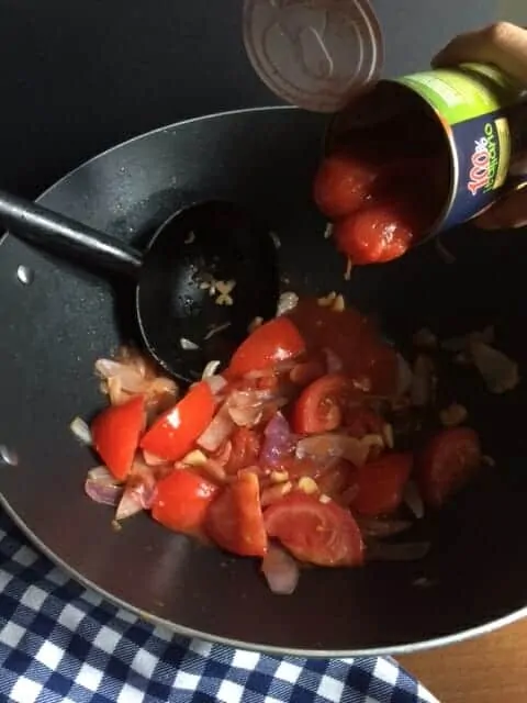 step five add the tomatoes