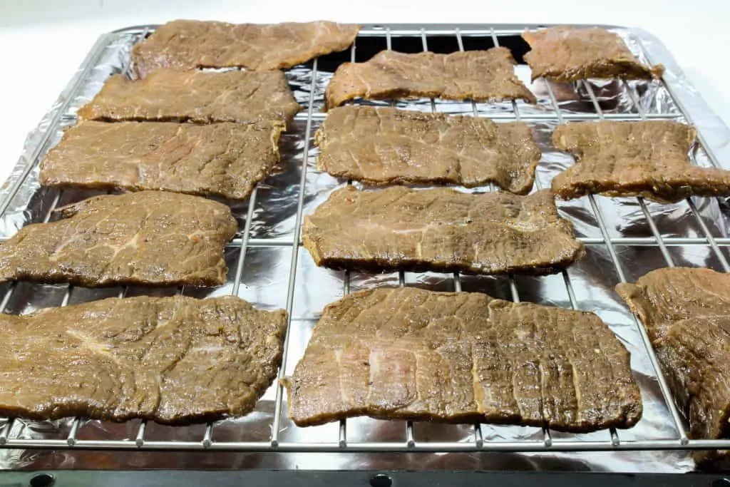 8. lay the beef strips in the cookie rack