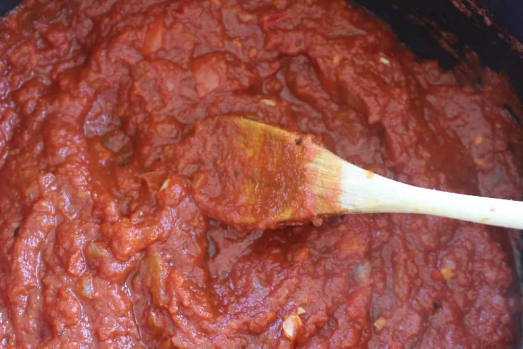 Shakshuka Step 4 Adding Tomato Sauce