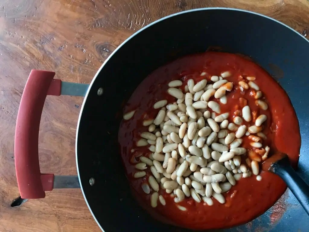 6.baked beans add in the beans and let simmer for an hour