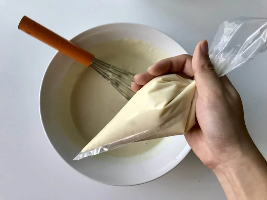 6.funnel cake pour the batter into a piping bag