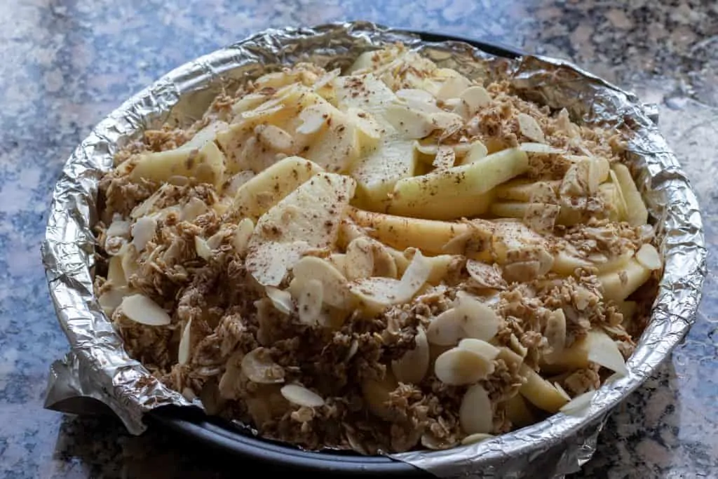 Apple Pie with Oatmeal Crust and Almond Granola Toppings Step 8 Add crumble to the top of pie 1