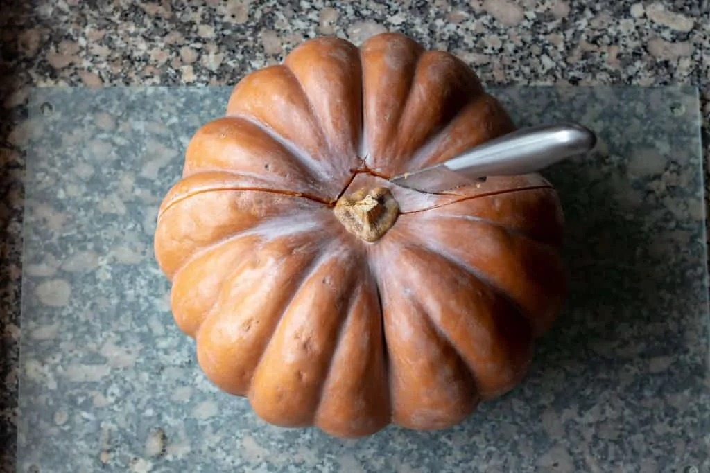 Pumpkin Pie with Vanilla Whipped Cream and Spiced Pepitas Step 1 Cut pumpkin 1