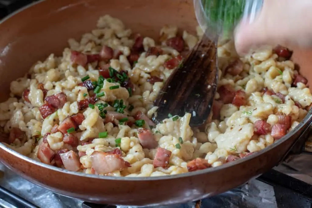 Butter Sauteed Herb Spaetzle with Crispy Smoked Ham Step 7 Add Chives and serve