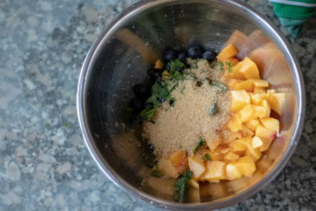 Blueberry and Nectarine Dessert Pierogi Step 6 sugar and mint to fruit