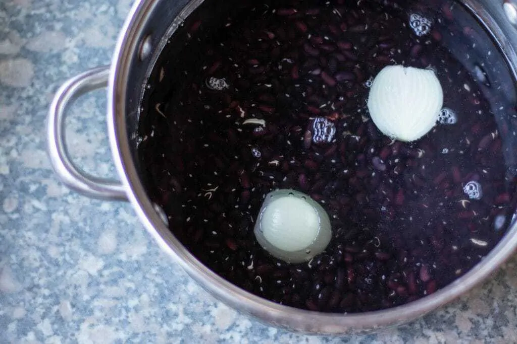 Healthy Vegetarian Refried Black Beans Step 2 add water and onion to beans