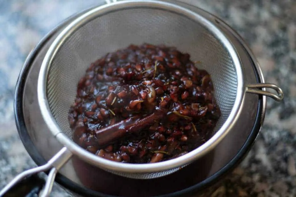 Pomegranate Orange Barbecue Sauce Step 7 strain the sauce